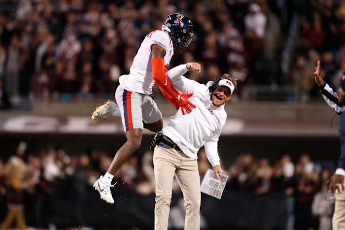 Nov 23, 2023; Starkville, Mississippi, USA; Mississippi Rebels defensive back Zamari Walton (6) and head coach Lane Kiffin (right) react after a missed field goal by the Mississippi State Bulldogs during the second half at Davis Wade Stadium at Scott Field. Mandatory Credit: Petre Thomas-USA TODAY Sports