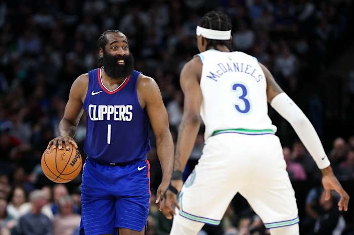 Mar 3, 2024; Minneapolis, Minnesota, USA; LA Clippers guard James Harden (1) dribbles as Minnesota Timberwolves forward Jaden McDaniels (3) defends during the second half at Target Center.