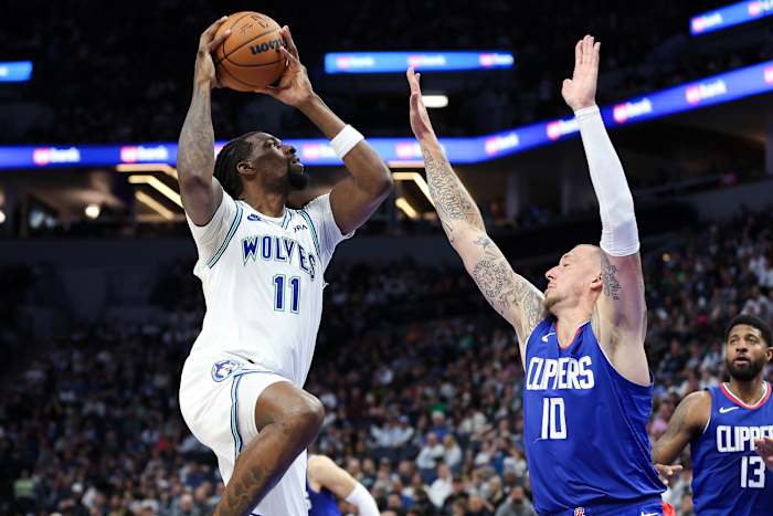 Minnesota Timberwolves center Naz Reid (11) shoots as LA Clippers center Daniel Theis (10) defends during the first half at Target Center in Minneapolis on March 3, 2024.