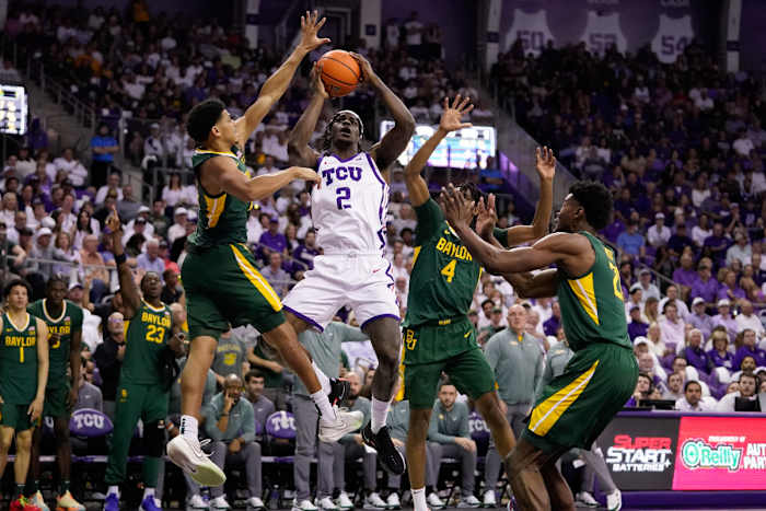 Feb 26, 2024; Fort Worth, Texas, USA; TCU Horned Frogs forward Emanuel Miller (2) drives to the basket on Baylor Bears guard RayJ Dennis (10) and guard Ja'Kobe Walter (4) during the first half at Ed and Rae Schollmaier Arena.