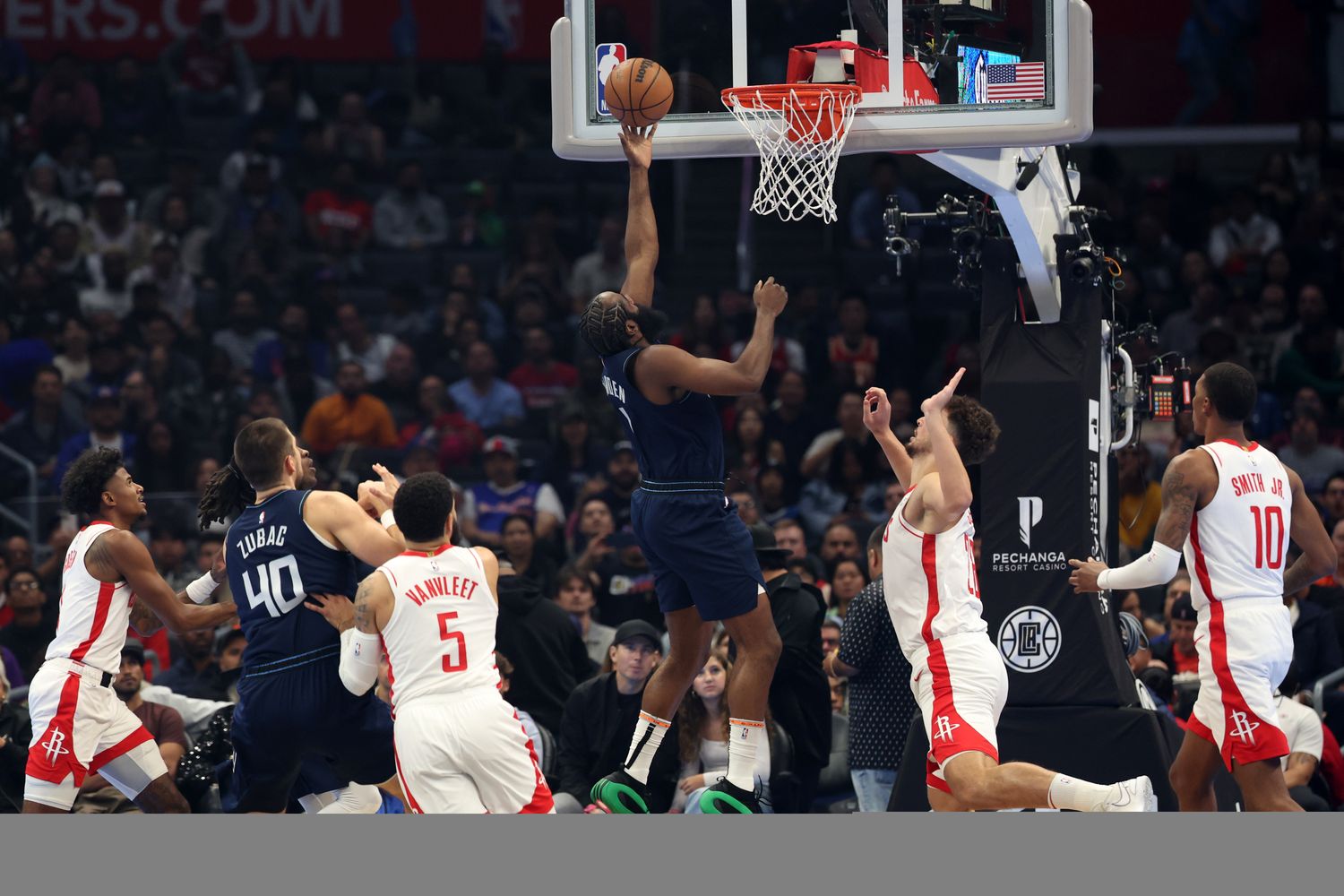 L.A. Clippers guard James Harden (1) drives to the basket during the first quarter against the Houston Rockets at Crypto.com Arena.