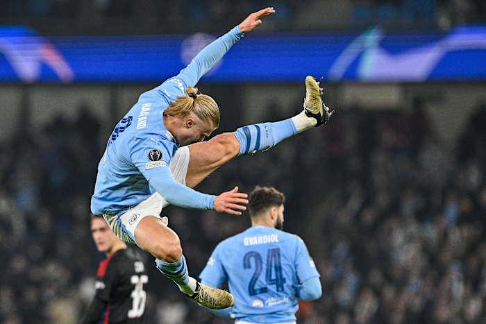 Erling Haaland pictured performing an acrobatic goal celebration after scoring for Manchester City in a 3-1 win over FC Copenhagen in the UEFA Champions League in March 2024