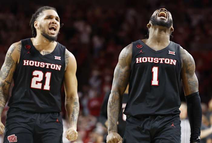 Mar 2, 2024; Norman, Oklahoma, USA; Houston Cougars guard Jamal Shead (1) and guard Emanuel Sharp (21) celebrate after Jamal scored a basket against the Oklahoma Sooners during the second half at Lloyd Noble Center.