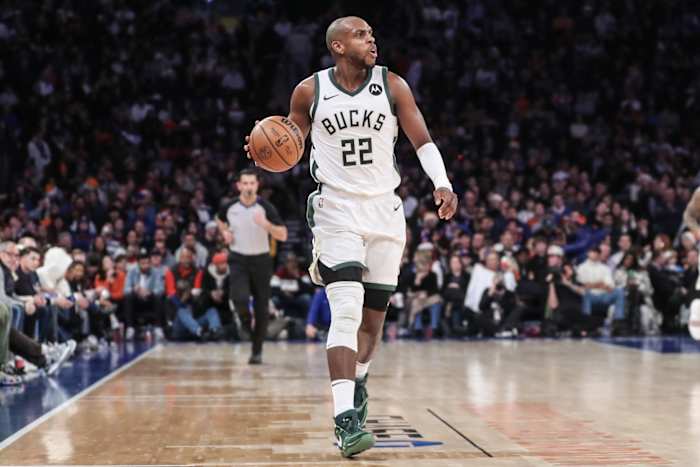 Milwaukee Bucks forward Khris Middleton (22) brings the ball up court in the fourth quarter against the New York Knicks