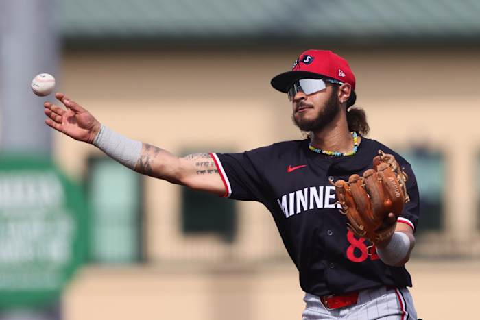 Mar 5, 2024; Jupiter, Florida, USA; Minnesota Twins second baseman Austin Martin (82) thorws to first base against the St. Louis Cardinals during the fourth inning at Roger Dean Chevrolet Stadium.
