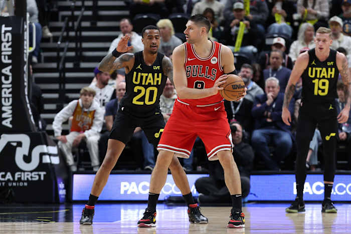 Chicago Bulls center Nikola Vucevic (9) posts up against Utah Jazz forward John Collins (20) during the first quarter at Delta Center.