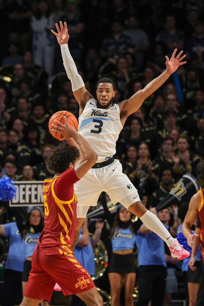 Mar 2, 2024; Orlando, Florida, USA; UCF Knights guard Darius Johnson (3) defends Iowa State Cyclones guard Curtis Jones (5) during the second half at Addition Financial Arena. Mandatory Credit: Mike Watters-USA TODAY Sports