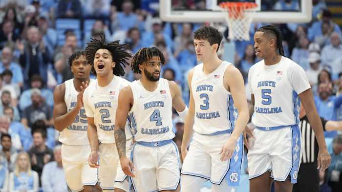 North Carolina Tar Heels forward Harrison Ingram (55) and guards Elliot Cadeau (2) and RJ Davis (4) and Cormac Ryan (3) and forward Armando Bacot (5) react in the second half at Dean E. Smith Center.
