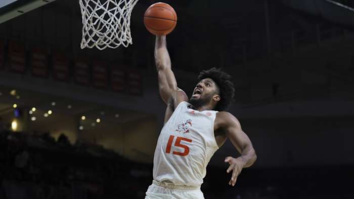 Miami Hurricanes forward Norchad Omier (15) dunks the basketball against the Virginia Tech Hokies during the second half at Watsco Center.