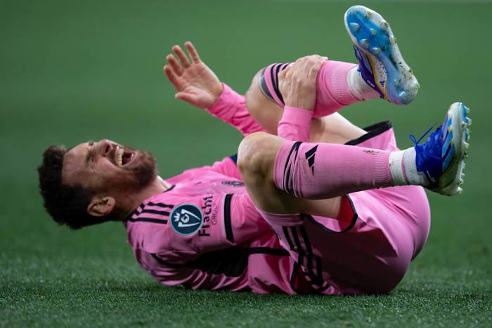 Lionel Messi pictured holding his left shin during Inter Miami's 2-2 draw at Nashville in March 2024
