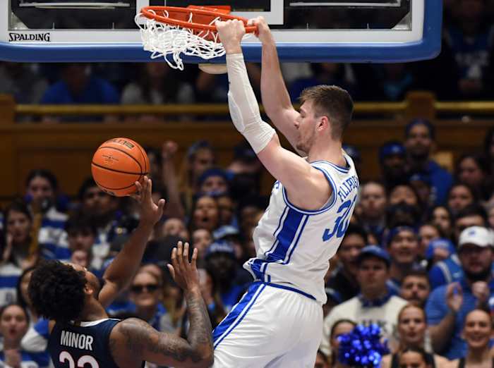 Duke Blue Devils center Kyle Filipowski (30) dunks in front of Virginia Cavaliers forward Jordan Minor (22) during the first half at Cameron Indoor Stadium.