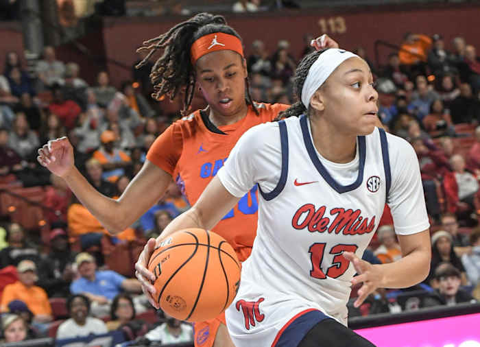 Ole Miss guard Mariyah Noel (13) dribbles by Florida guard Jeriah Warren (20) during the first quarter of the SEC Women's Basketball Tournament game at the Bon Secours Wellness Arena in Greenville, S.C. Friday, March 8, 2024.
