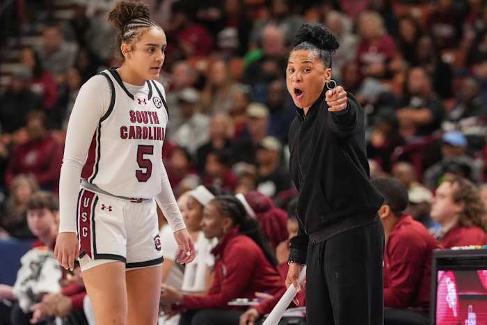 Gamecock guard Tessa Johnson receiving instruction from head coach Dawn Staley (8th Mar., 2024)