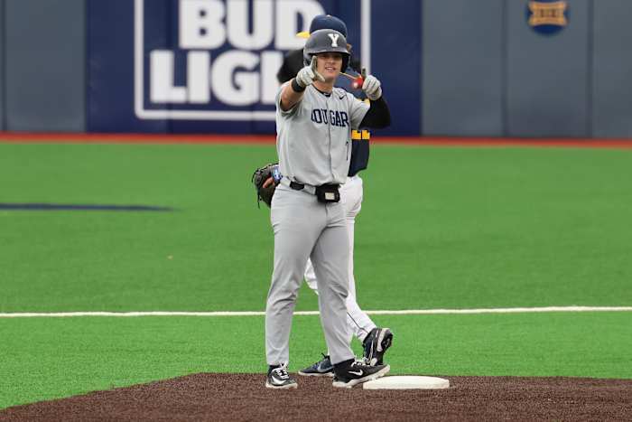 BYU first baseman Cooper Vest points to the Cougars dugout after delivering a double in the fourth inning.