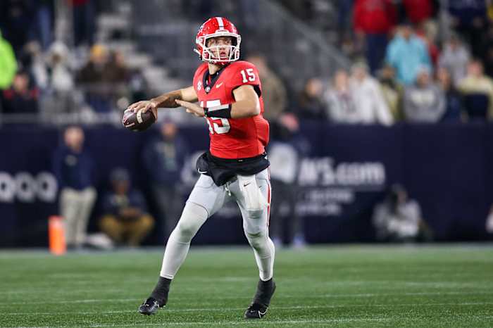 Nov 25, 2023; Atlanta, Georgia, USA; Georgia Bulldogs quarterback Carson Beck (15) drops back to pass against the Georgia Tech Yellow Jackets in the second half at Bobby Dodd Stadium at Hyundai Field.
