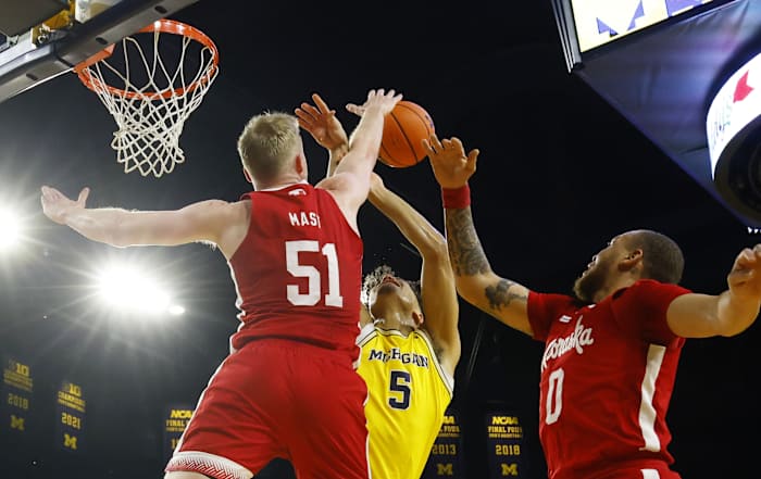 Mar 10, 2024; Ann Arbor, Michigan, USA; Nebraska Cornhuskers forward Rienk Mast (51) blocks a shot by Michigan Wolverines forward Terrance Williams II (5) during the first half at Crisler Center.