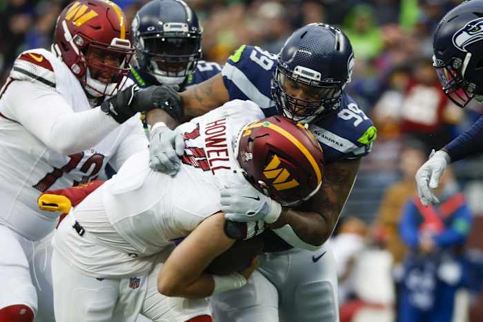 Seattle Seahawks defensive end Leonard Williams (99) sacks Washington Commanders quarterback Sam Howell (14). Mandatory Credit: Joe Nicholson-USA TODAY