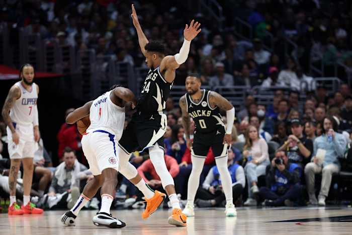 Milwaukee Bucks forward Giannis Antetokounmpo (34) defends Los Angeles Clippers guard James Harden (1)