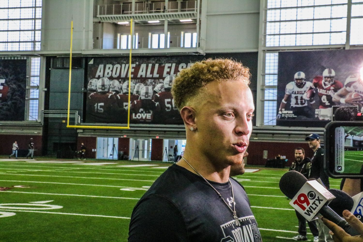 Spencer Rattler chats with the local media after his workout