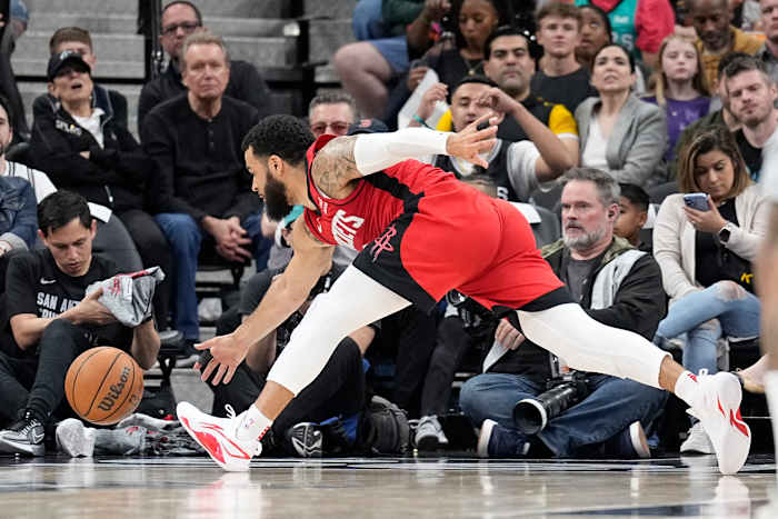 Rockets guard Fred VanVleet (5) reaches for a ball during the first half against the San Antonio Spurs at Frost Bank Center.