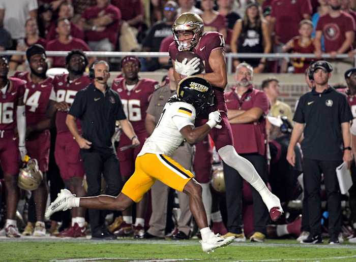 Sep 9, 2023; Tallahassee, Florida, USA; Florida State Seminoles wide receiver Johnny Wilson (14) cannot reel in a pass as he is defended by Southern Miss Golden Eagles defensive back Brendan Toles (0) during the first half at Doak S. Campbell Stadium. Mandatory Credit: Melina Myers-USA TODAY Sports