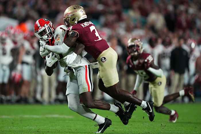 Dec 30, 2023; Miami Gardens, FL, USA; Georgia Bulldogs wide receiver Marcus Rosemy-Jacksaint (1) makes a catch against Florida State Seminoles defensive back Kevin Knowles II (3) during the second half in the 2023 Orange Bowl at Hard Rock Stadium. Mandatory Credit: Jasen Vinlove-USA TODAY Sports