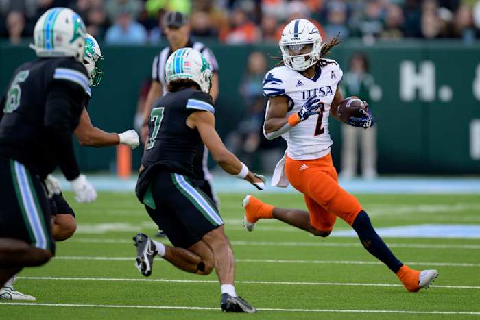Nov 24, 2023; New Orleans, Louisiana, USA; UTSA Roadrunners wide receiver Joshua Cephus (2) runs against Tulane Green Wave defensive back Lance Robinson (7) during the first half at Yulman Stadium. Mandatory Credit: Matthew Hinton-USA TODAY Sports