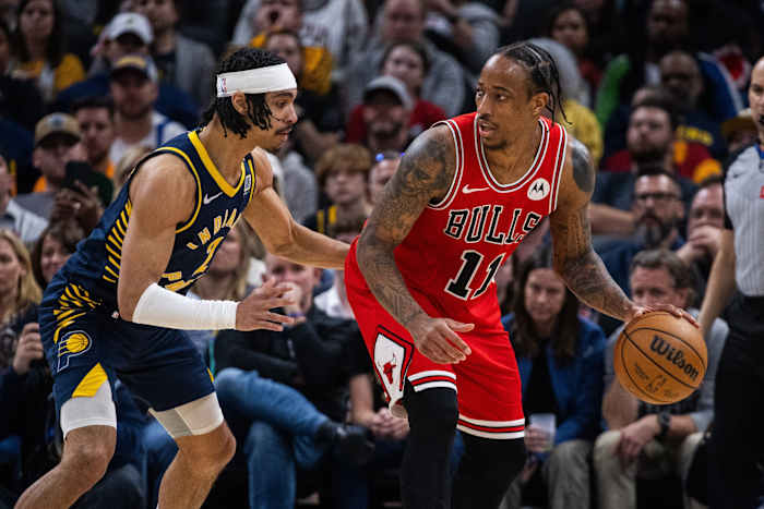Chicago Bulls forward DeMar DeRozan (11) dribbles the ball while Indiana Pacers guard Andrew Nembhard (2) defends in the second half at Gainbridge Fieldhouse.