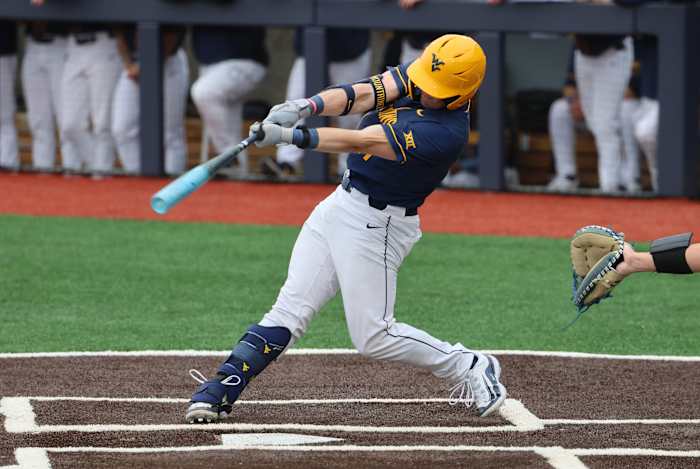 Sophomore Sam White records one of his five hits in the series against BYU.