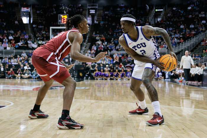 Mar 13, 2024; Kansas City, MO, USA; Oklahoma Sooners guard Otega Oweh (3) guards TCU Horned Frogs forward Emanuel Miller (2) during the first half at T-Mobile Center.