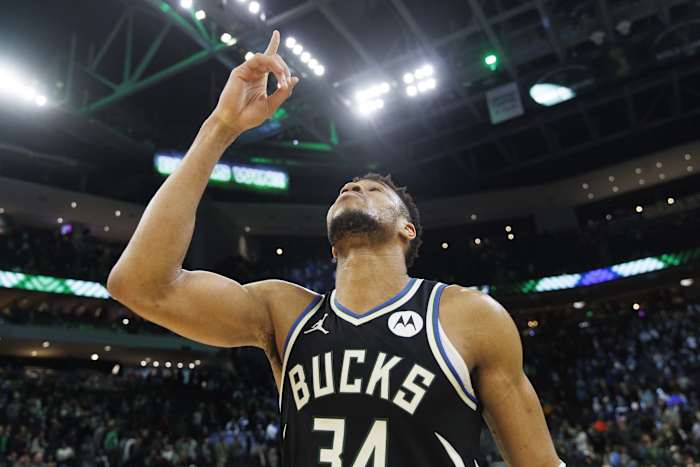 Milwaukee Bucks forward Giannis Antetokounmpo (34) points to the sky 