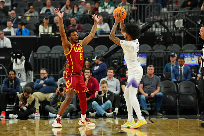USC Trojans guard Bronny James defends Washington Huskies guard Koren Johnson.