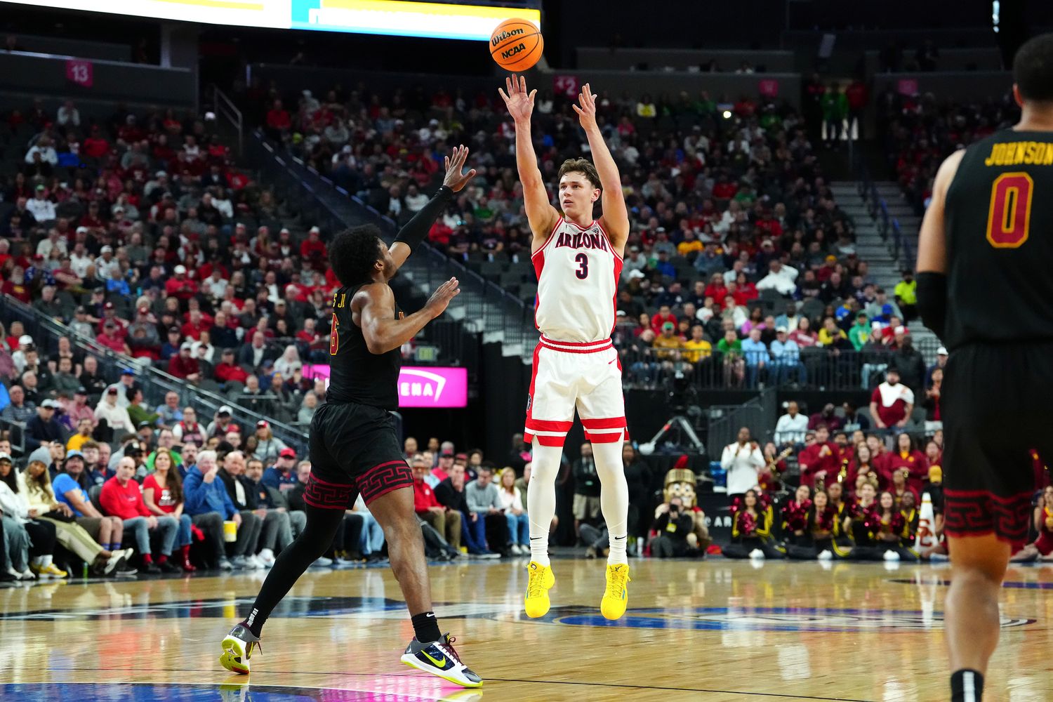 Arizona Wildcats guard Pelle Larsson shoots against USC Trojans guard Bronny James.