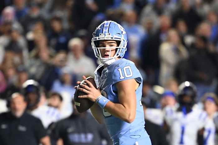 Nov 11, 2023; Chapel Hill, North Carolina, USA; DUPLICATE***North Carolina Tar Heels quarterback Drake Maye (10)***North Carolina Tar Heels defensive lineman Desmond Evans (10) looks to pass in the second quarter at Kenan Memorial Stadium.