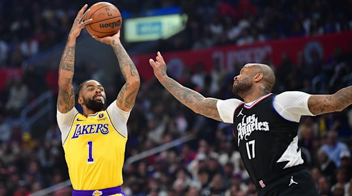 Los Angeles Lakers guard D'Angelo Russell (1) shoots against Los Angeles Clippers forward P.J. Tucker (17) during the first half at Crypto.com Arena in Los Angeles on Feb. 28, 2024.