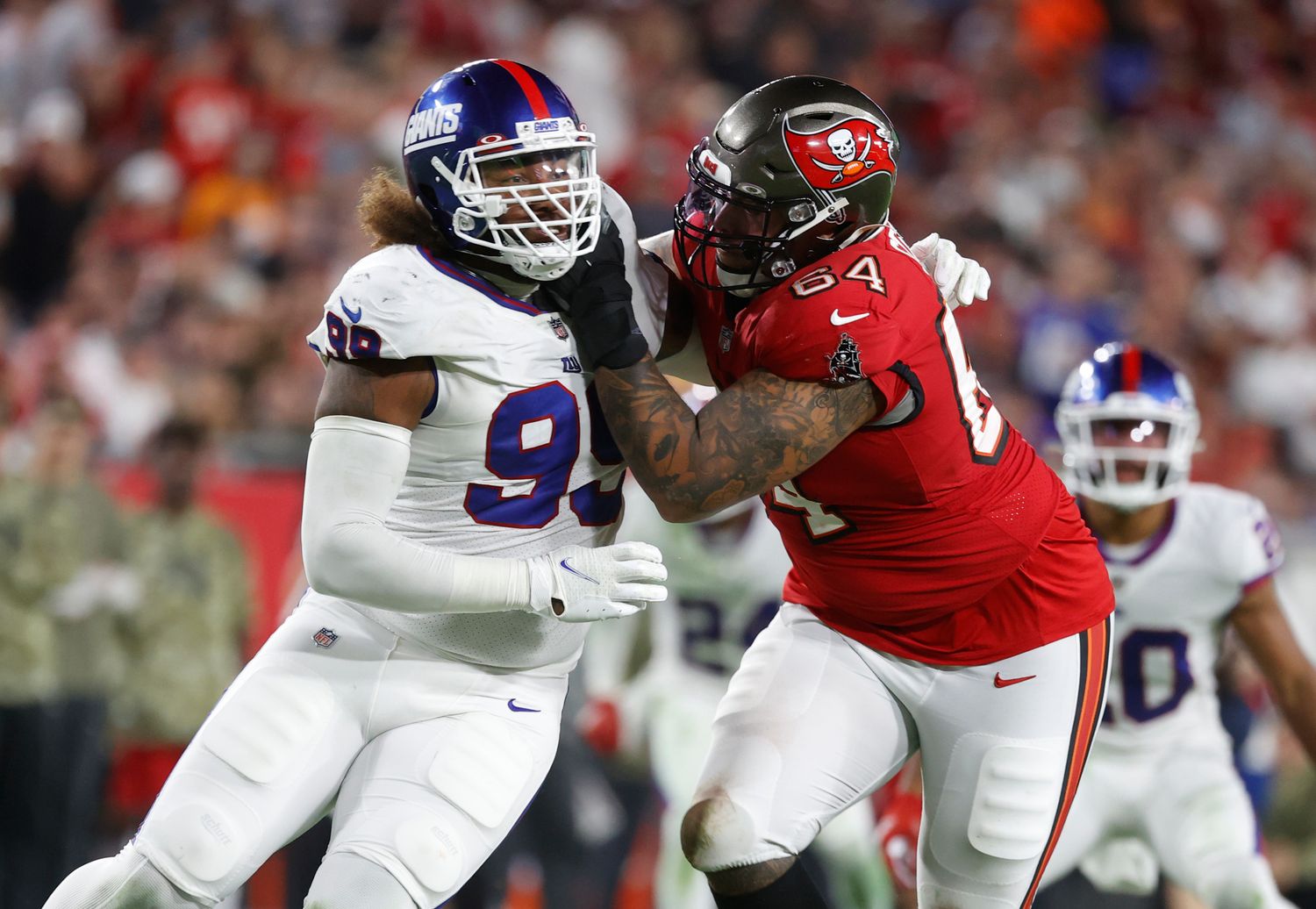 New York Giants defensive end Leonard Williams (99) rushes as Tampa Bay Buccaneers guard Aaron Stinnie (64) blocks during the second half at Raymond James Stadium. Mandatory Credit: Kim Klement-USA TODAY Sports