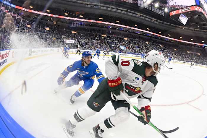Mar 16, 2024; St. Louis, Missouri, USA; Minnesota Wild center Marcus Johansson (90) controls the puck as St. Louis Blues defenseman Matthew Kessel (51) defends during the first period at Enterprise Center.