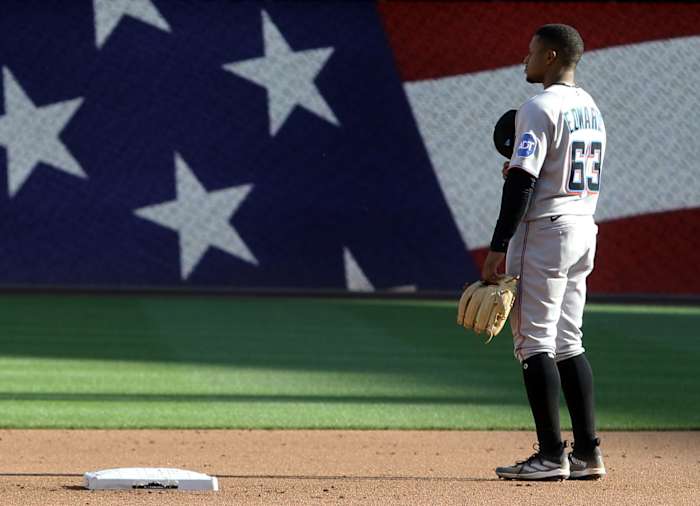 Oct 1, 2023; Pittsburgh, Pennsylvania, USA; Miami Marlins second baseman Xavier Edwards (63) stands for the playing of God Bless America against the Pittsburgh Pirates during the seventh inning at PNC Park. Mandatory Credit: Charles LeClaire-USA TODAY Sports