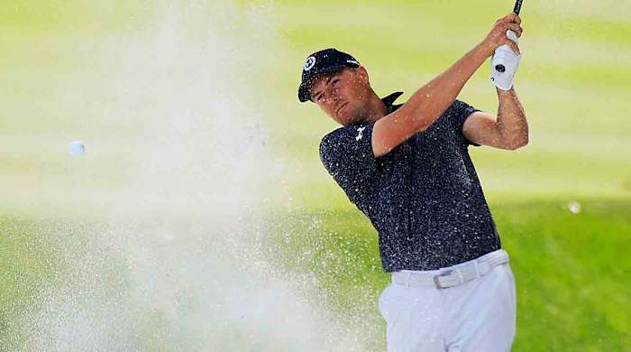 Jordan Spieth plays a shot from a bunker during the 2024 Players Championship at TPC Sawgrass in Ponte Vedra Beach, Fla.