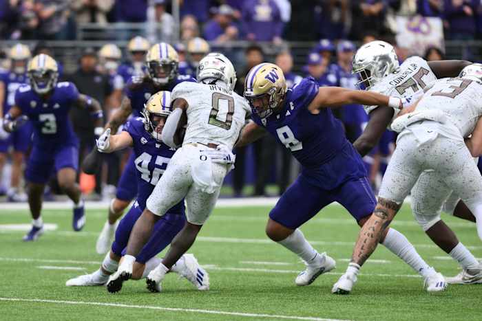 Washington Huskies defensive end Bralen Trice (8) tackles Oregon Ducks running back Bucky Irving (0). Mandatory Credit: Steven Bisig-USA TODAY Sports