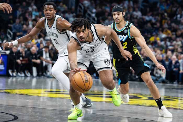 Brooklyn Nets guard Cam Thomas (24) dribbles the ball past Indiana Pacers guard Andrew Nembhard (2)