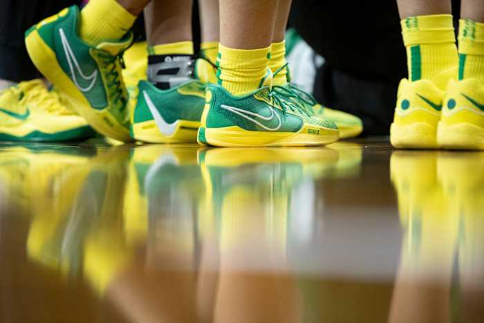 Side view of Sabrina Ionescu's green and yellow Nike sneakers.
