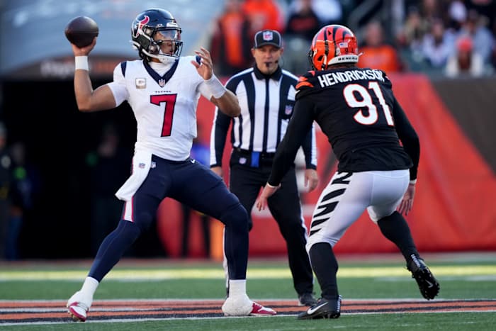 C.J. Stroud (7) throws under pressure from Cincinnati Bengals defensive end Trey Hendrickson (91) in Week 10 NFL football game between the Houston Texans and the Cincinnati Bengals