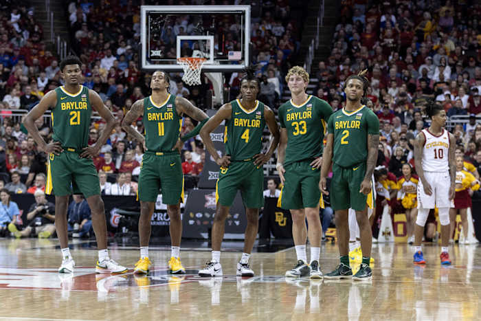 Mar 15, 2024; Kansas City, MO, USA; Baylor Bears watch Iowa State Cyclones shoot a technical free throw during the first half at T-Mobile Center.