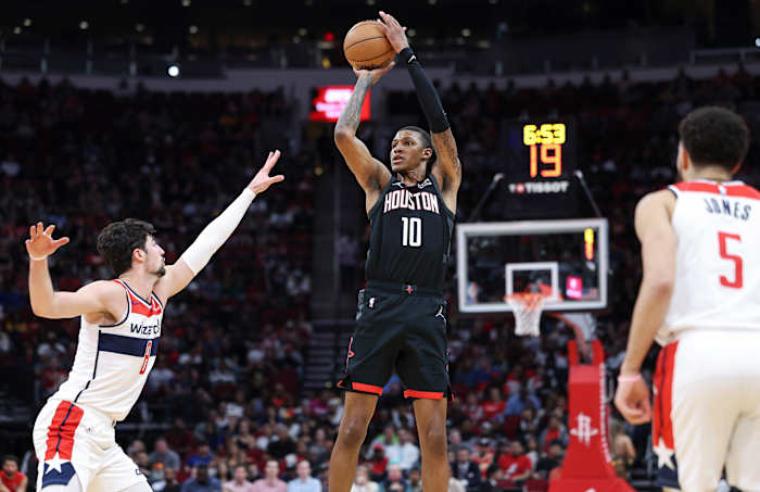 Rockets forward Jabari Smith Jr. (10) shoots the ball as Washington Wizards forward Deni Avdija (8) defends during the second quarter at Toyota Center.