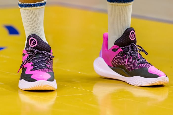 Golden State Warriors guard Stephen Curry's pink and black sneakers.