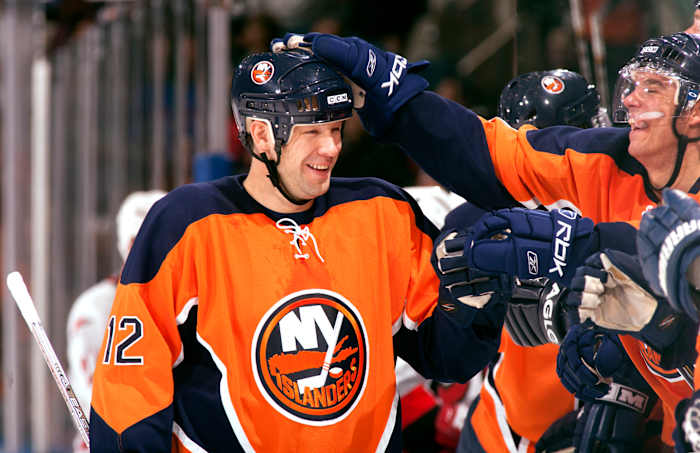 New York Islanders left wing Chris Simon (12) celebrates with teammates against the Carolina Hurricanes at Nassau Veterans Memorial Coliseum in Uniondale, N.Y., on Oct. 21, 2006.