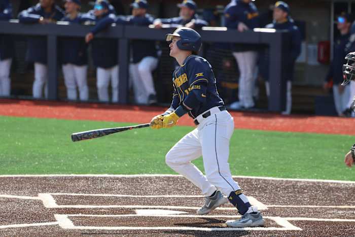 West Virginia senior Reed Chumley watches his first of two home runs against Marshall.