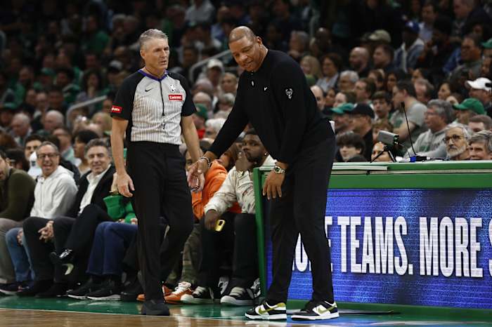 Milwaukee Bucks head coach Doc Rivers slumps down as he talks to referee Scott Foster (48)