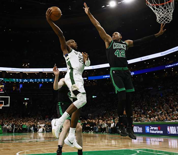 Boston Celtics center Al Horford (42) defends against Milwaukee Bucks forward Khris Middleton (22)